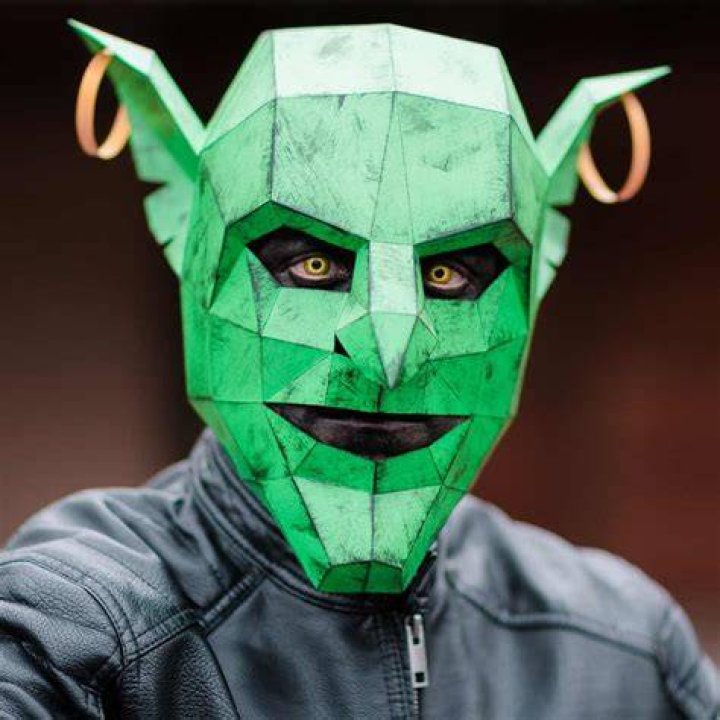 A goblin wearing a mask inspired by medieval beekeepers &mdash; with wicker bands over its eyes &mdash; calls forth a swarm of insects from beneath its tattered robes.