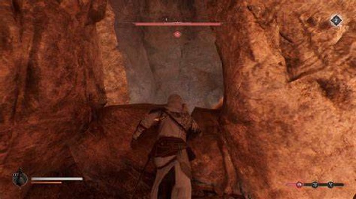Basim climbing up a cliff in Assassin&rsquo;s Creed Mirage.