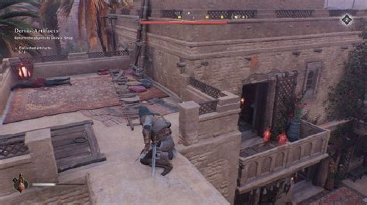 Basim crawls along a rooftop in AC Mirage while looking for Gear Chests.