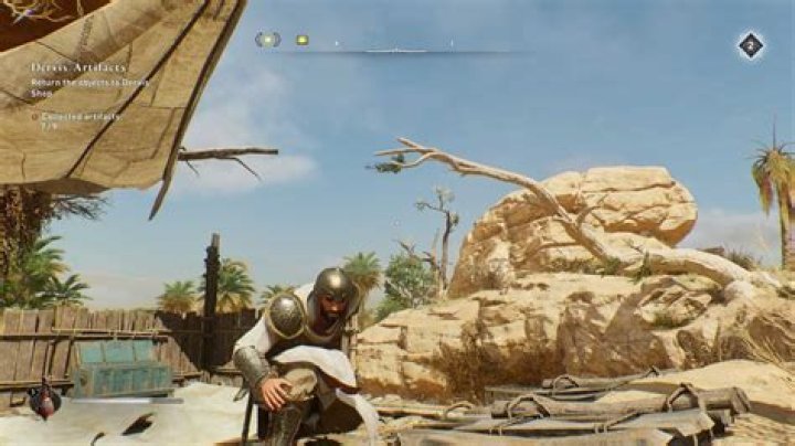 Basim crouching next to tree branches in Assassin&rsquo;s Creed Mirage.