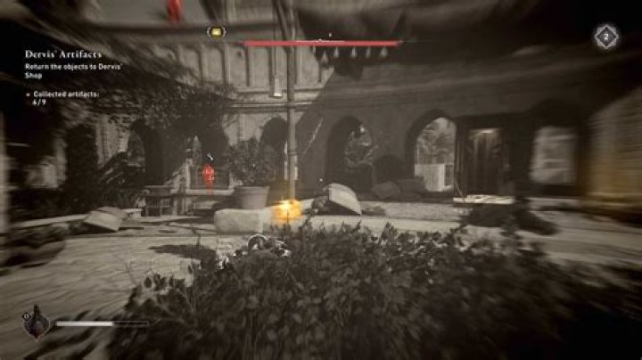 Basim hides in bushes looking for a gear chest location in AC Mirage.