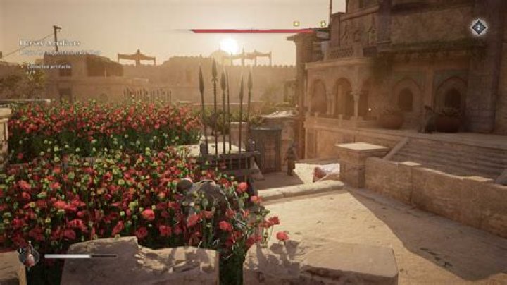 Basim hides in some bushes while looking for Gear Chests in AC Mirage.