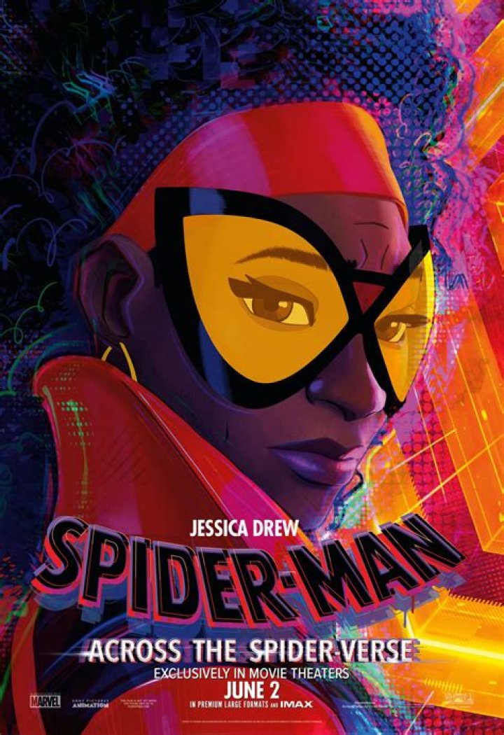 Jess Drew in Spider-Man: Across the Spider-Verse. She has an afro and is pregnant and wears a cool biker-style version of the Spider-Man look.