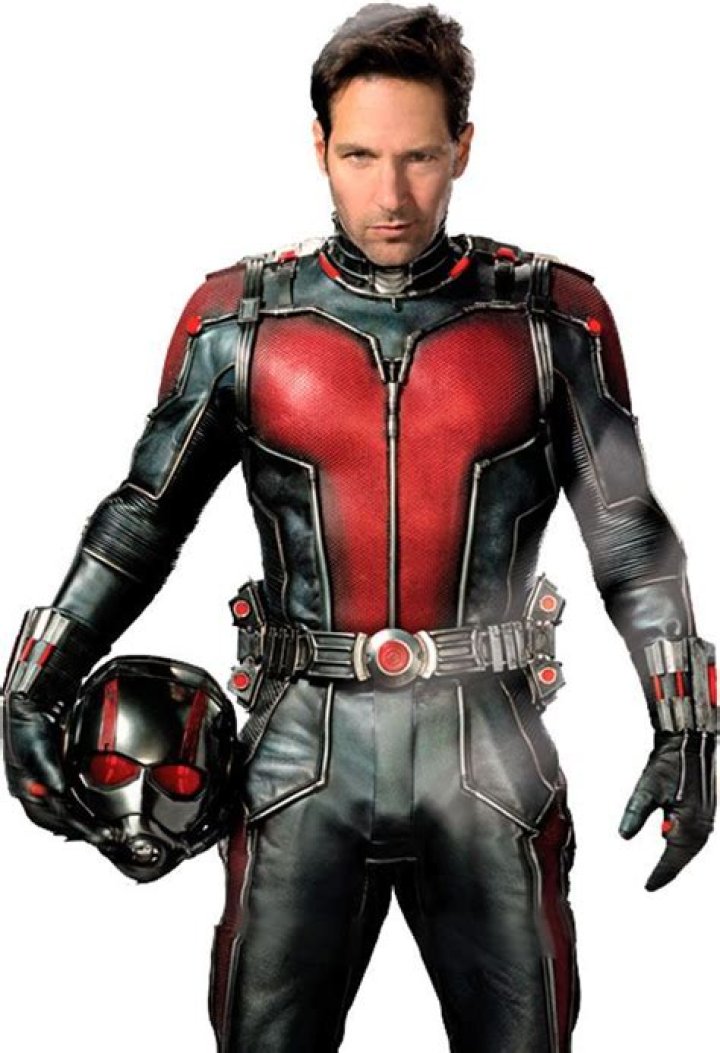 (L-R): Paul Rudd as Scott Lang/Ant-Man and Kathryn Newton as Cassandra &ldquo;Cassie&rdquo; Lang in Ant-Man and the Wasp: Quantumania. They stand stock still in an an alien landscape, surrounded by the place&rsquo;s strange denizens.