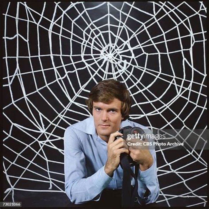 Peter Parker sits on a rooftop with his mask off in the Spectacular Spider-Man cartoon series. 